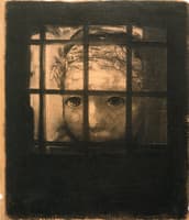 Wreathed Head behind Bars
