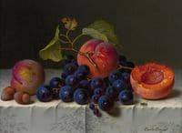 Still life with peaches, grapes and nuts on a table