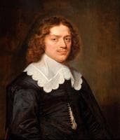 Portrait of a Young Man in a Black Dress with a White Lace Collar