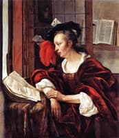 A Woman with a Book at a Window