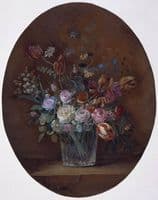 A glass containing roses, tulips, lily of the valley and violas