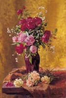 A vase of roses with carnations on a draped table