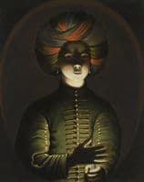 A young girl wearing a turban and holding a candle