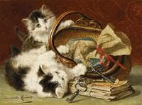 Two kittens playing with a basket