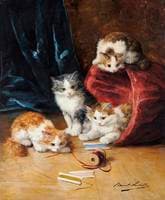 four kittens playing in a sewing basket