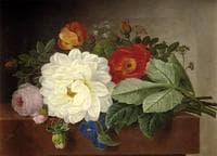 A bouquet of flowers on a marble ledge