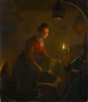 A woman in a kitchen by the light of an oil lamp