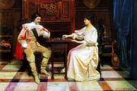 Man and woman playing chess