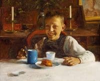 A happy boy on the breackfast table