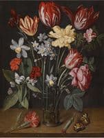 A still life with tulips, daffodils, carnations and other flowers in a vase