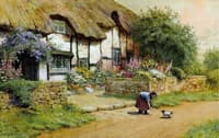 Befriending a puppy outside a cottage garden