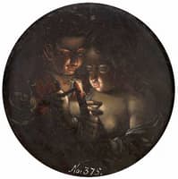 Boy and girl lighting a candle