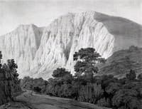A hilly landscape with a winding road