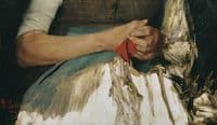Two hands with red cloth on blue apron