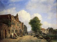 A View in a Town with Townsfolk on a Street along a Canal