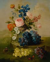 Still life of flowers in a glass vase with grapes, resting on a stone ledge in a landscape