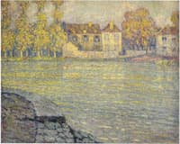 Houses by the river at sunset