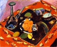 Dishes and Fruit on a Red and Black Carpet
