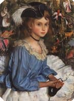 Katya in blue dress by a Christmas tree