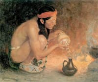 Indian beside a Camp Fire