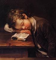 A schoolboy sleeping on his book